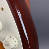 Ding on body of Used 2015 Fender Custom Shop Artisan Okoume Strat.