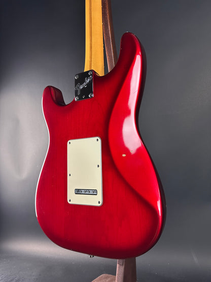 Red electric guitar on a gray background