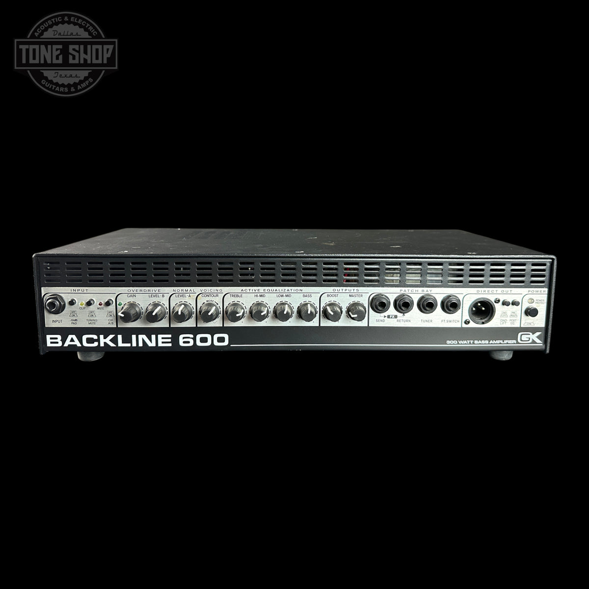 A Backline 600 speaker amplifier shown from the front against a solid black background, with a Tone Shop watermark in the upper left corner.