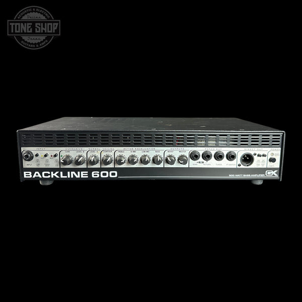 A Backline 600 speaker amplifier shown from the front against a solid black background, with a Tone Shop watermark in the upper left corner.