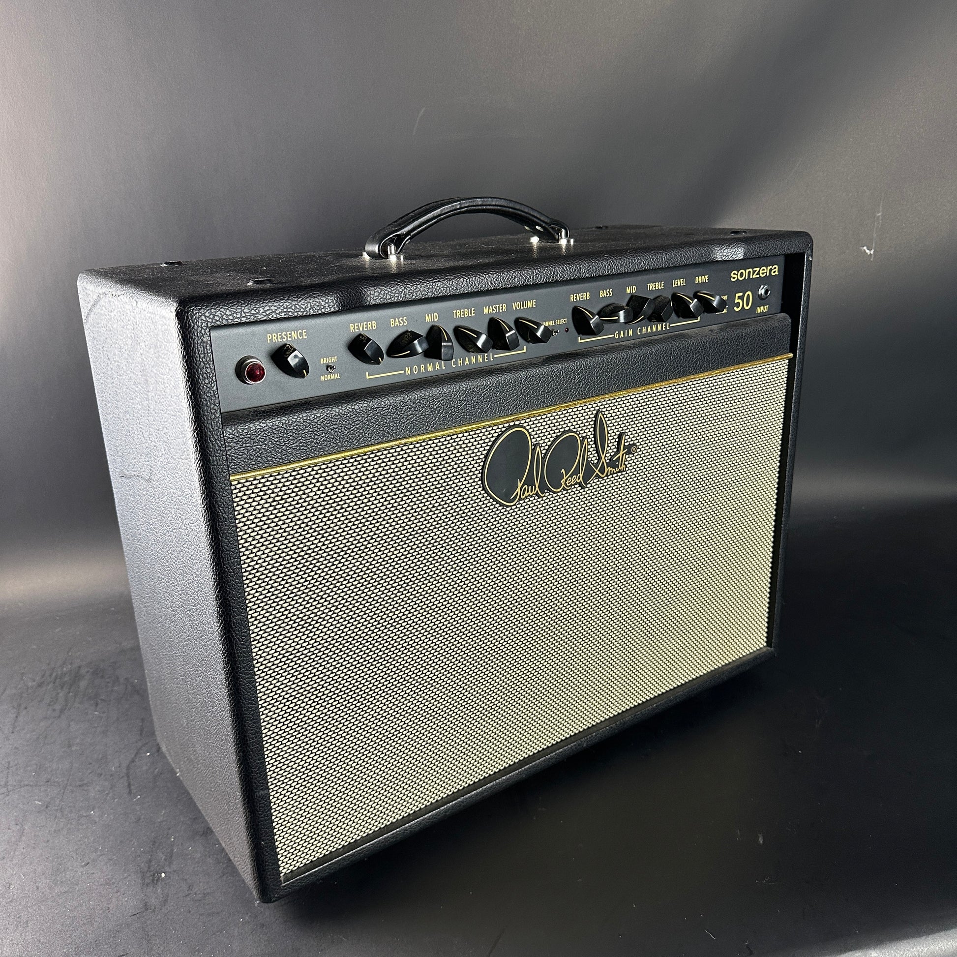 Guitar amplifier with visible brand logo on a gray background