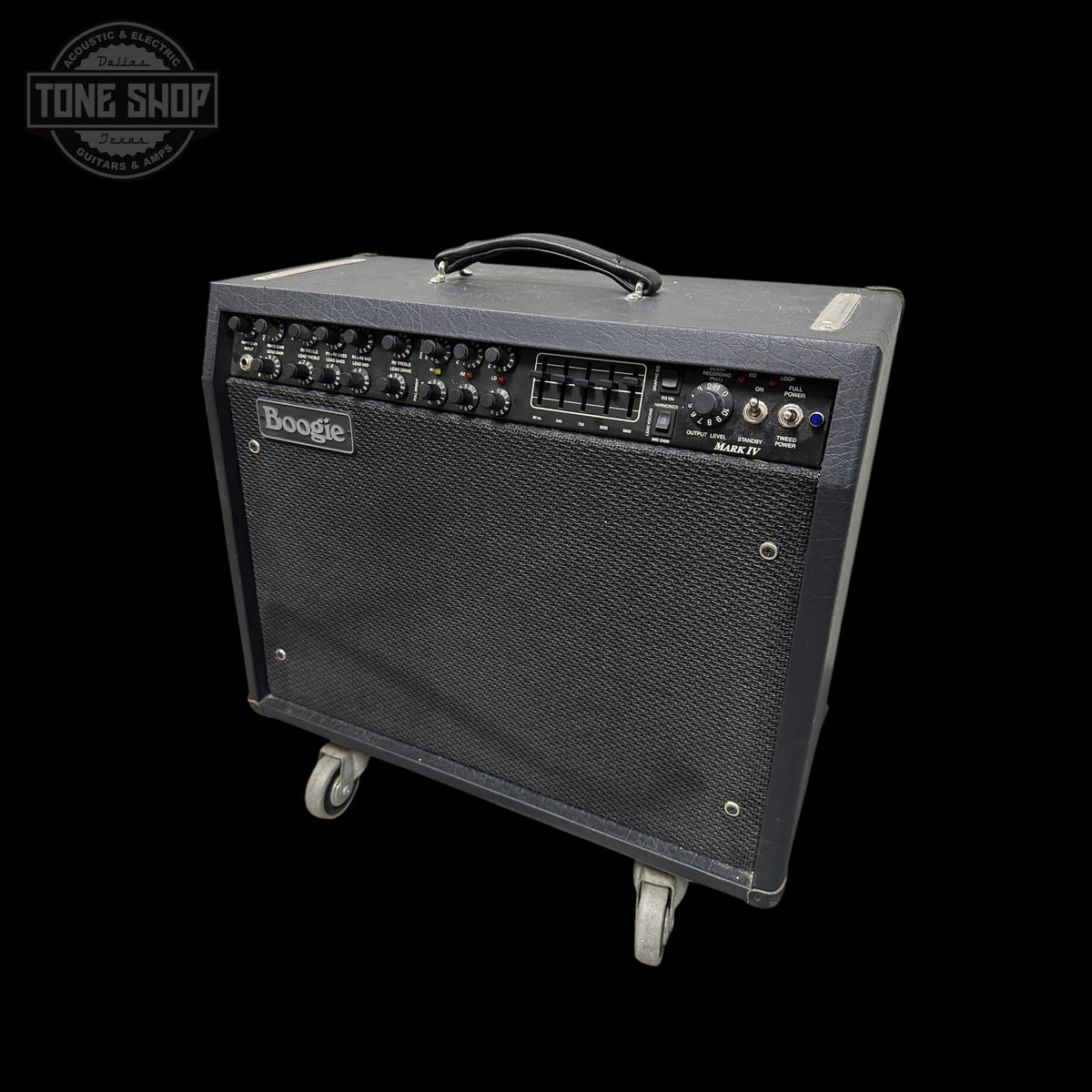 A Boogie guitar amplifier with a black textured cabinet, front speaker grille, and top carry handle, shown on a black background with a Tone Shop watermark in the upper left.
