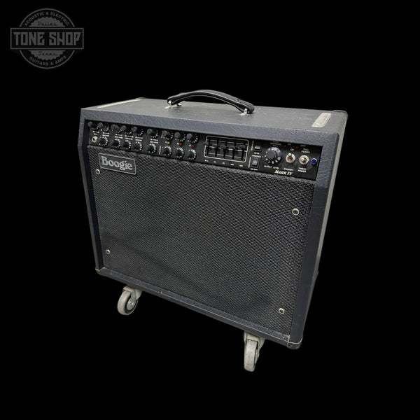 A Boogie guitar amplifier with a black textured cabinet, front speaker grille, and top carry handle, shown on a black background with a Tone Shop watermark in the upper left.
