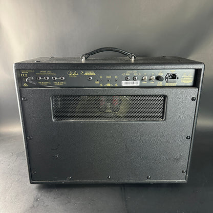 Black guitar amplifier with visible brand logo on a gray background