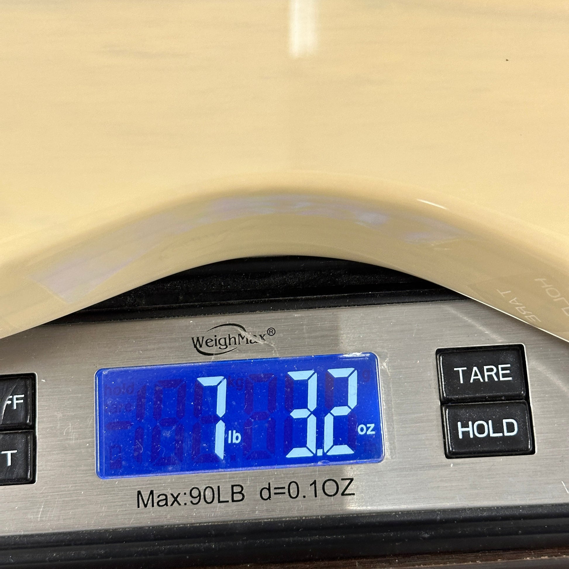 Digital scale displaying weight with 'Weight Master' branding