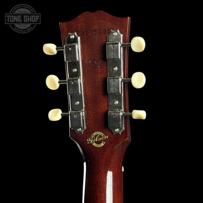 Gibson guitar headstock with brand logo on a black background