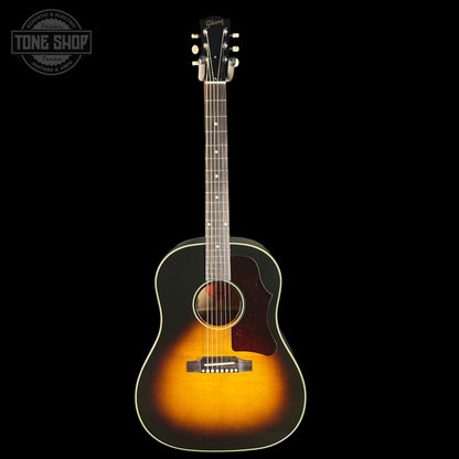 Acoustic guitar with a sunburst finish on a black background, featuring the Tone Shop logo.