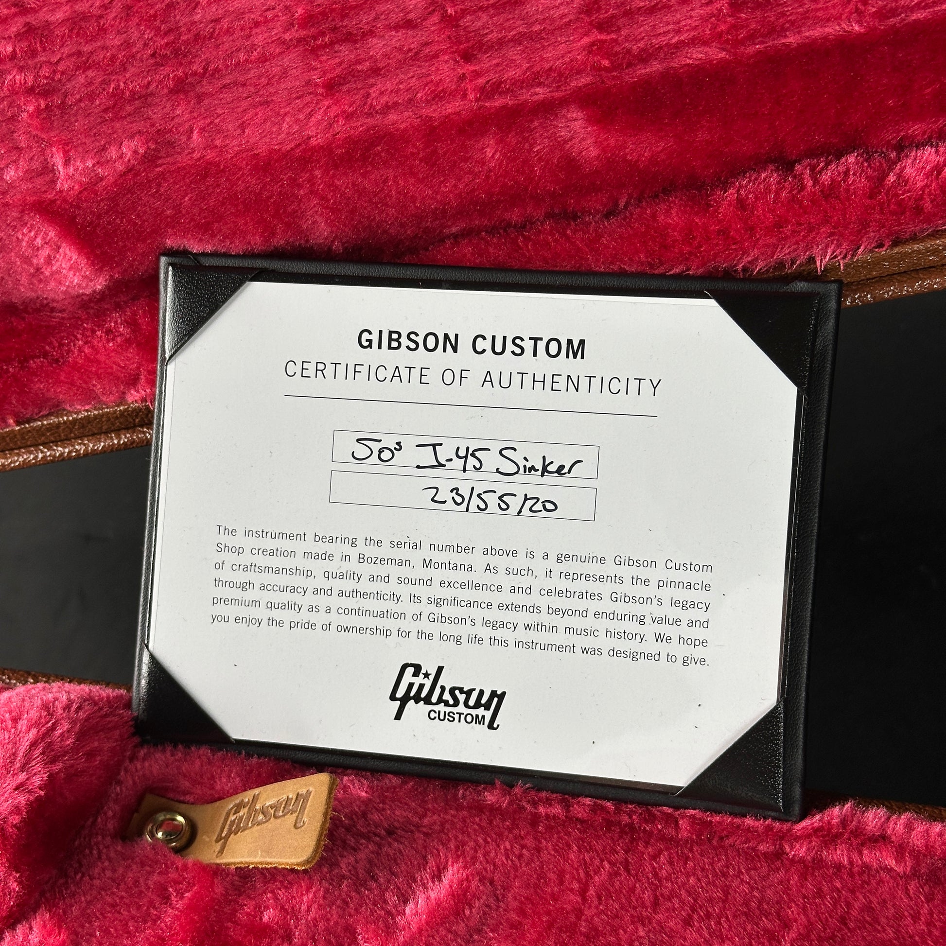 Gibson Custom Certificate of Authenticity on a red surface