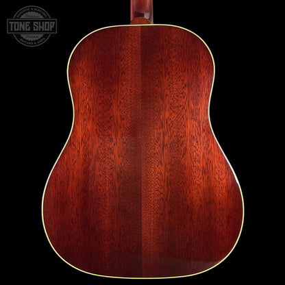 Close-up of a wooden acoustic guitar body with 'Tone Shop' logo in the corner.