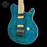 Front angle of Ernie Ball Music Man 30th Anniversary Axis Translucent Blue Quilt.
