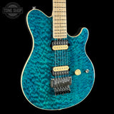 Front angle of Ernie Ball Music Man 30th Anniversary Axis Translucent Blue Quilt.