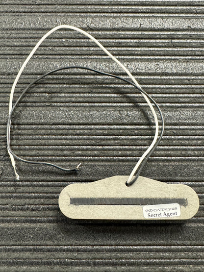 Small electronic device with a label on a textured surface