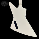White guitar body with a black pickguard on a black background, featuring 'Tone Shop' logo.