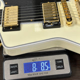 Guitar on a digital scale displaying weight