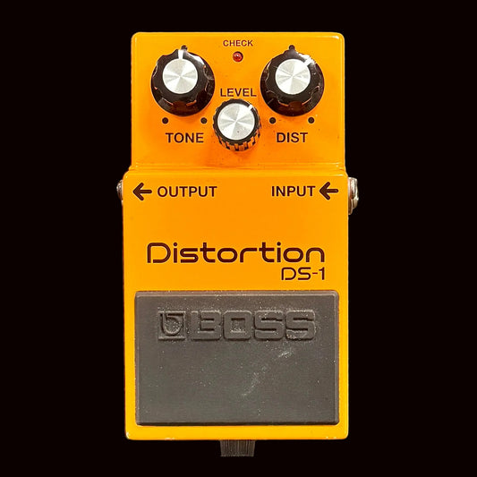 Boss DS-1 distortion pedal on a textured surface