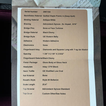 Technical specifications sheet for a guitar on a cardboard background