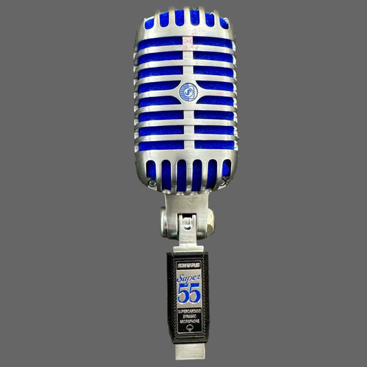 Vintage-style microphone with blue and silver design on a textured gray background