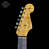 Fender guitar headstock on a black background with 'Tone Shop' logo.