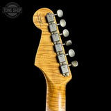 Guitar headstock with tuning pegs on a black background, featuring the Tone Shop logo.