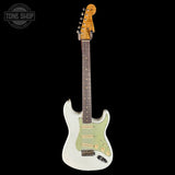 Electric guitar with a white pickguard and wooden neck on a black background