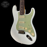White electric guitar with green pickguard on a black background, featuring 'Tone Shop' logo.