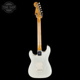 White electric guitar with a wooden neck on a black background, featuring 'Tone Shop' branding.