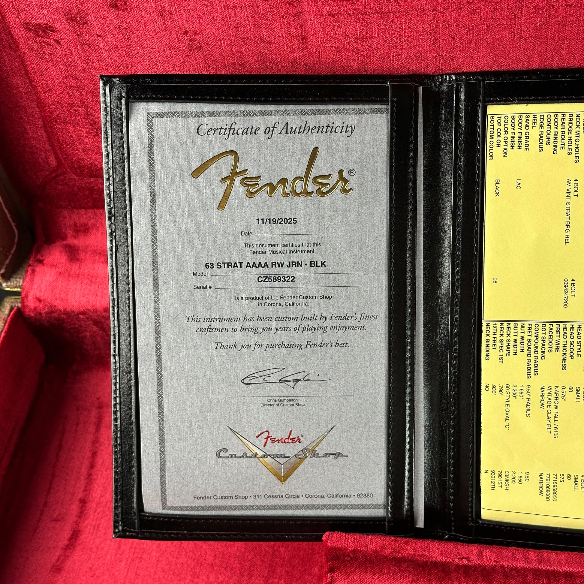 Fender certificate of authenticity and warranty card on a red background