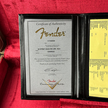Fender certificate of authenticity and warranty card on a red background