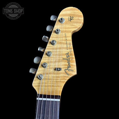 Fender Stratocaster guitar headstock on a black background