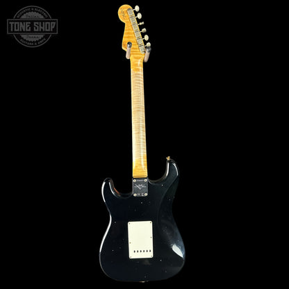 Black electric guitar with a blonde fretboard on a black background, featuring 'Tone Shop' branding.