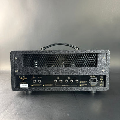 Black guitar amplifier head with visible brand name on a gray background