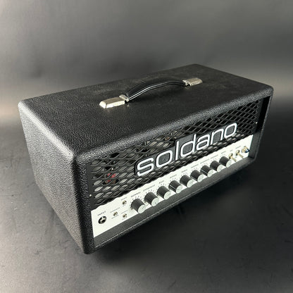 Black Soldano guitar amplifier head on a gray background