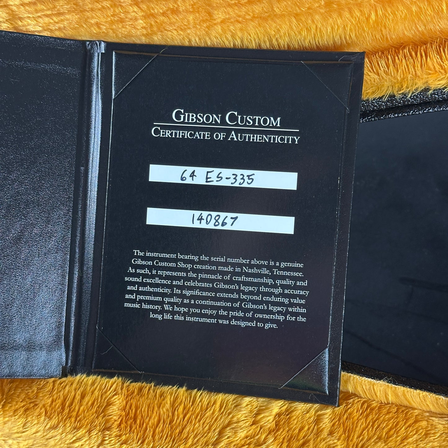Gibson Custom Certificate of Authenticity on a textured surface