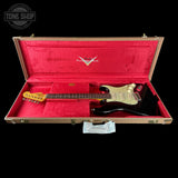 Fender electric guitar in a red case with 'Tone Shop' logo.