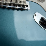 Wear below bridge of Used 2010 Fender Custom Shop Greg Fessler Masterbuilt 50s Closet Classic Strat Lake Placid Blue.