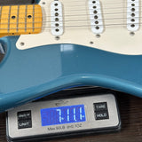 Used 2010 Fender Custom Shop Greg Fessler Masterbuilt 50s Closet Classic Strat Lake Placid Blue on scale displaying weight.