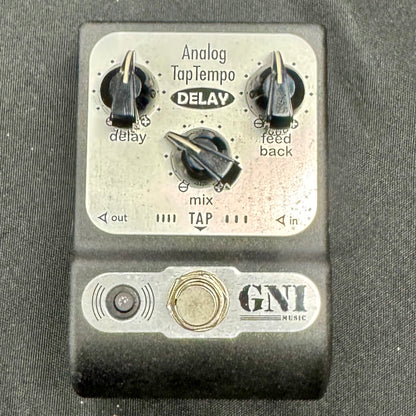 GNI music analog tap tempo delay effect pedal on a gray background