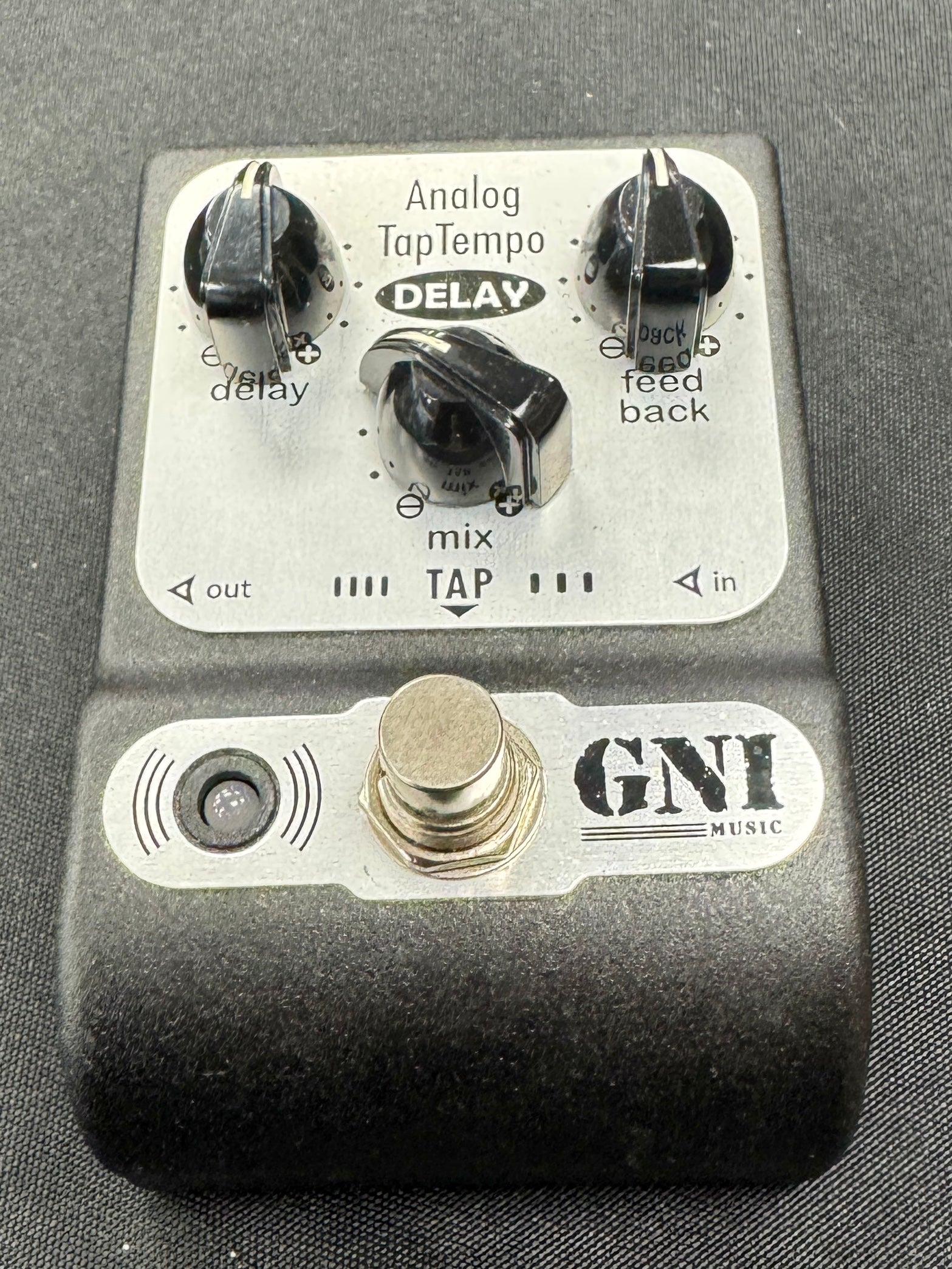 GNI music guitar effects pedal on a gray background