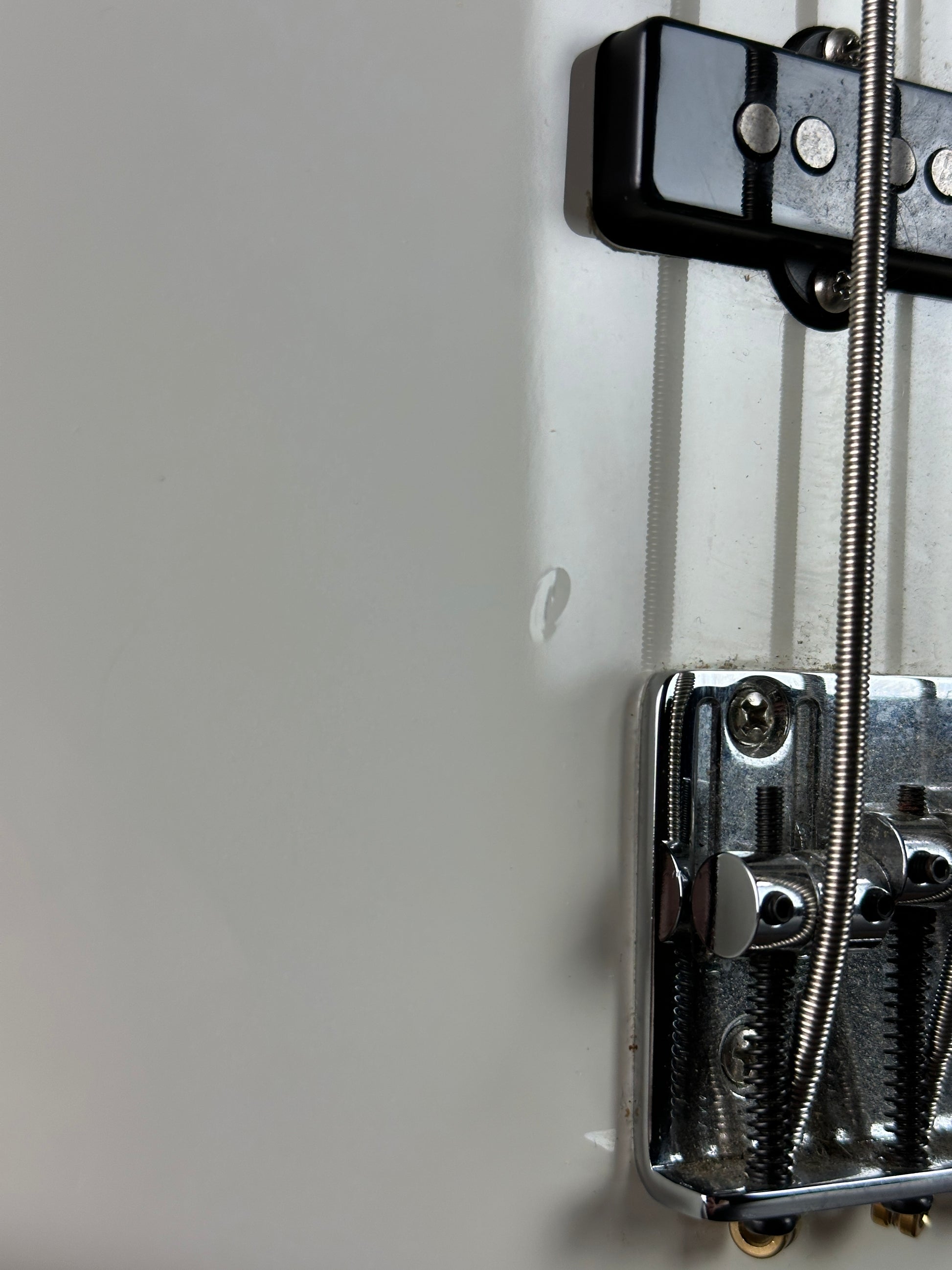 Close-up of a mechanical device with metal components on a light gray background