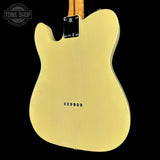 The back of a Fender Telecaster-style electric guitar body in a satin gold finish, shown against a solid black background with a Tone Shop watermark in the top-left corner.