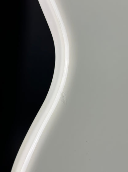 Ding on side of Used Fender Player Series Jazz Bass V White.