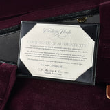 A black presentation box containing a Certificate of Authenticity card for a C.F.