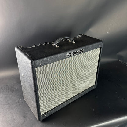 Fender guitar amplifier on a gray surface with a dark background
