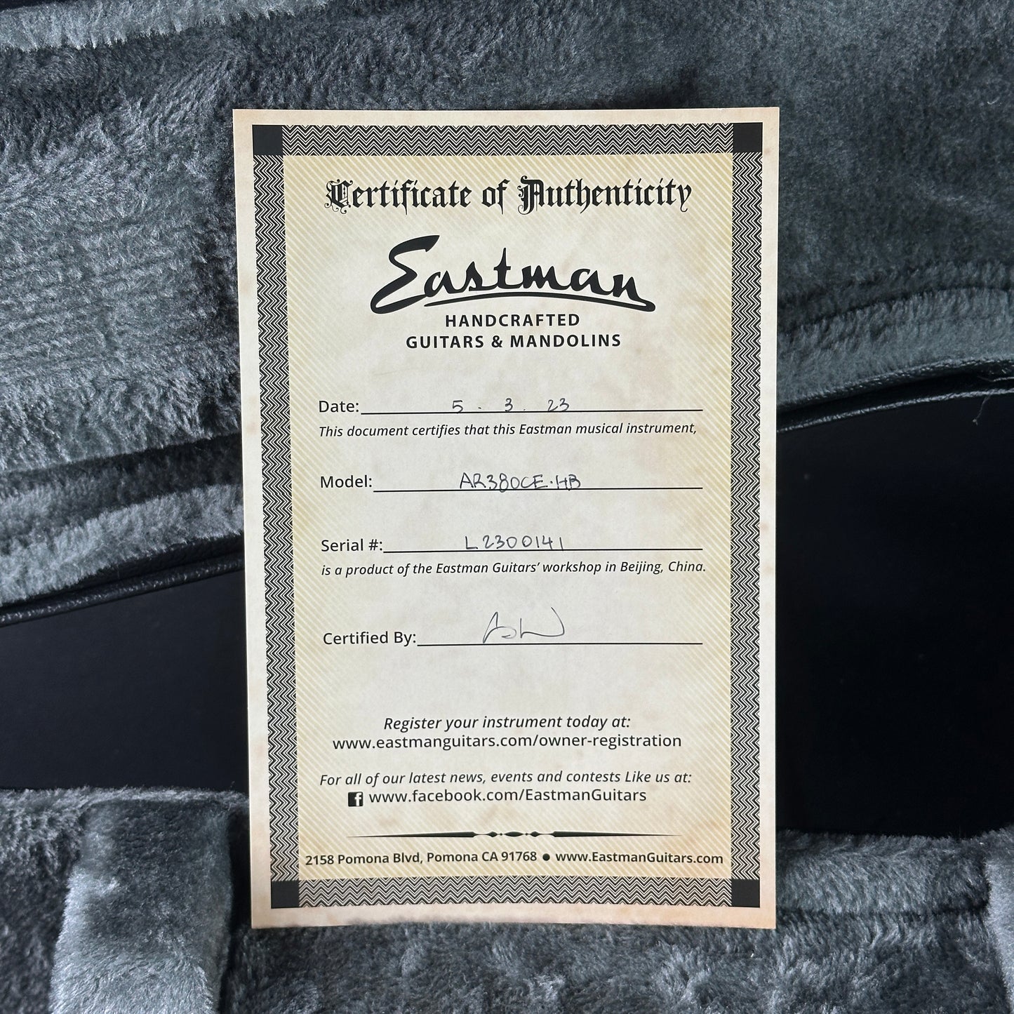 Eastman Certificate of Authenticity for a musical instrument on a textured surface