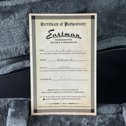 Eastman Certificate of Authenticity for a musical instrument on a textured surface