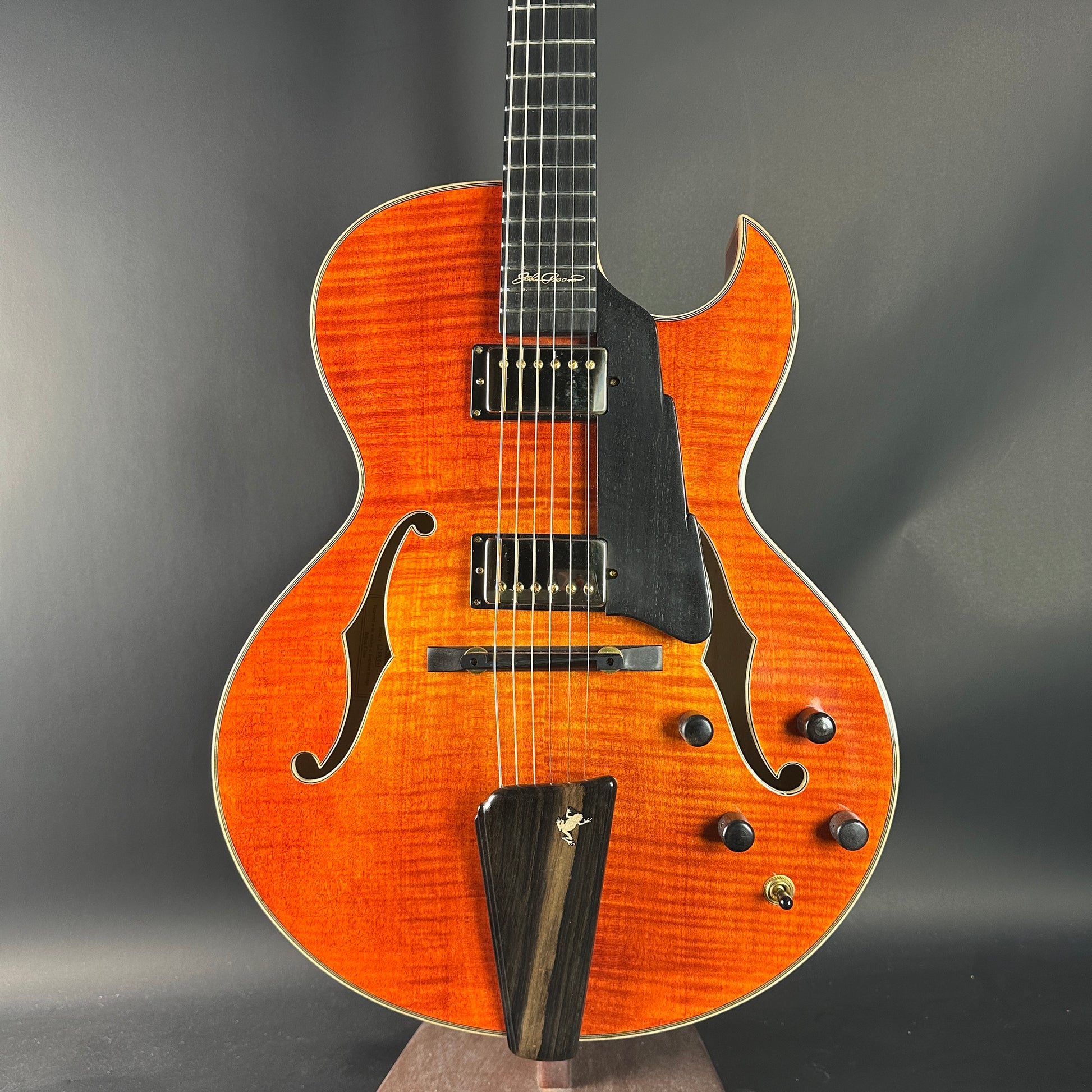 Electric guitar with a sunburst finish on a gray background