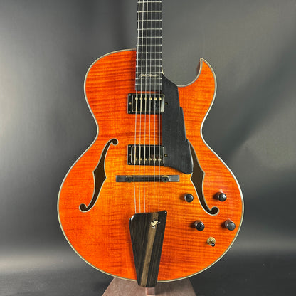 Electric guitar with a sunburst finish on a gray background