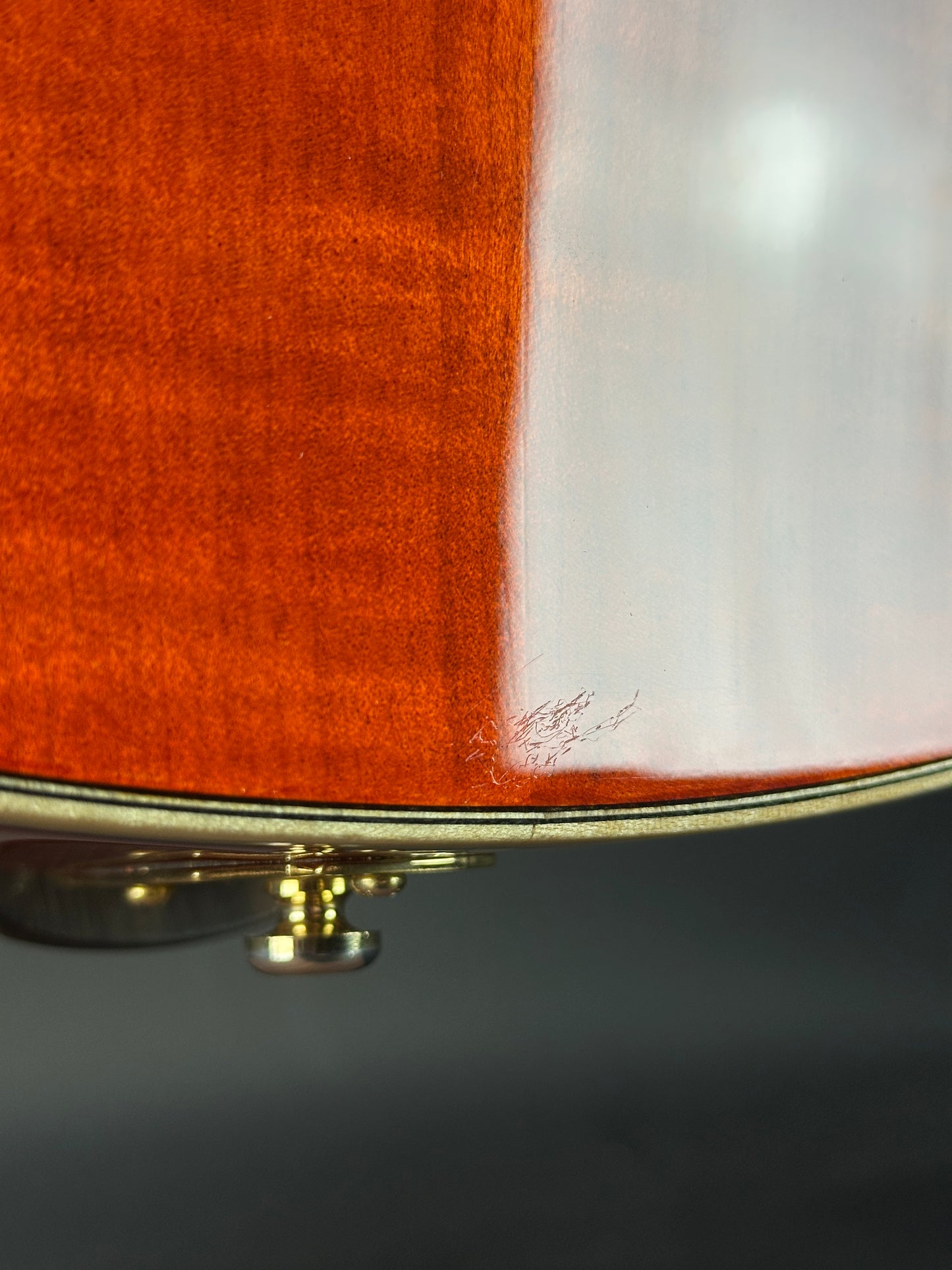 Close-up of a guitar's soundhole with a blurred background