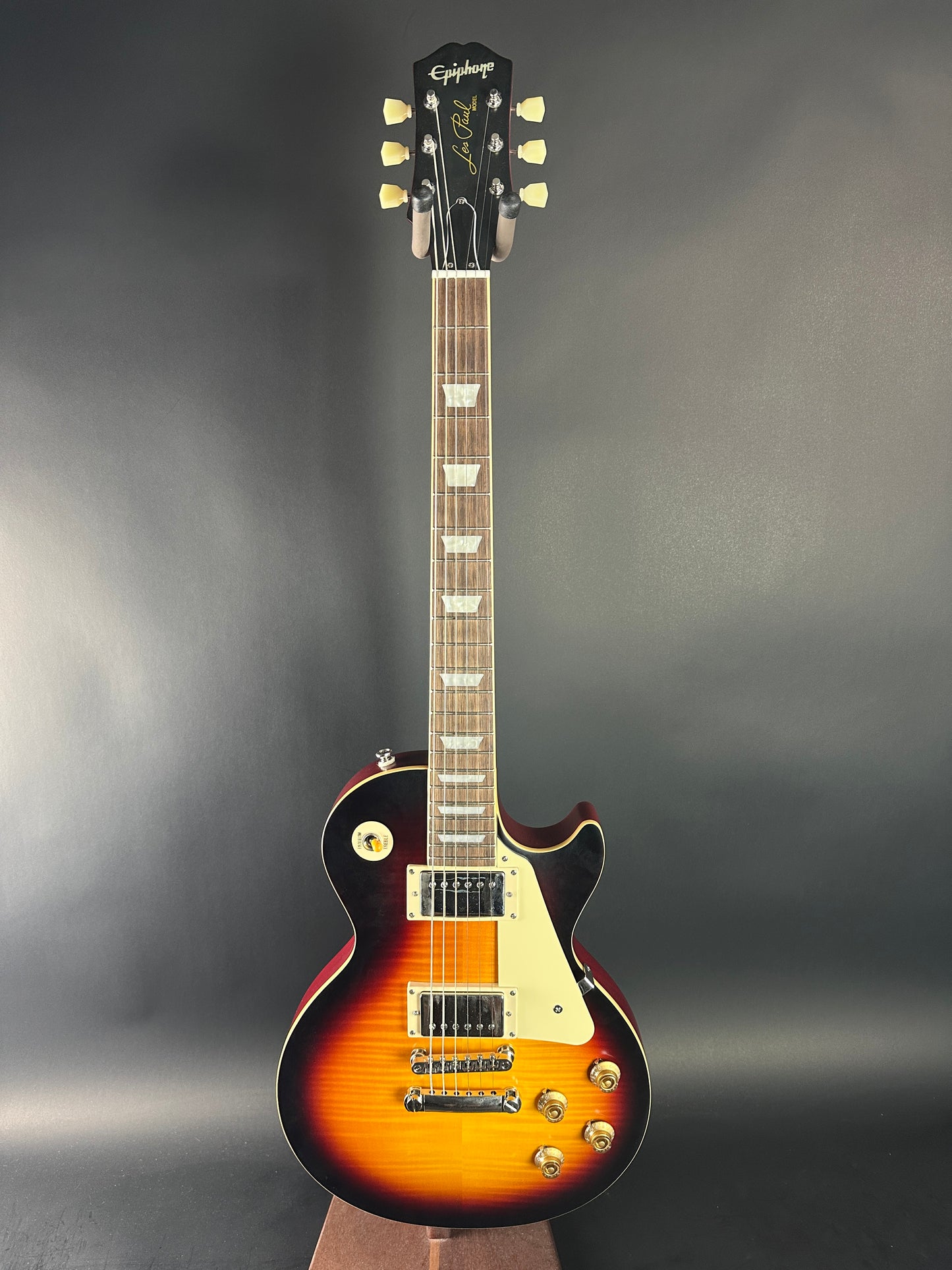 Electric guitar with a sunburst finish on a dark background