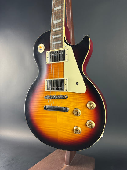 Electric guitar with a sunburst finish on a dark background